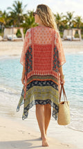 Back view of boho patchwork kimono cover-up showing draped hemline on beach