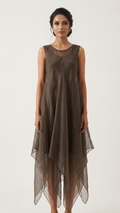 A woman modeling a sleeveless, high-low midi dress made of sheer taupe-brown mesh fabric, set against a plain off-white studio background.
